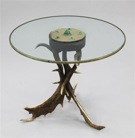 Anthony Redmile. A circular glass top occasional table, W.2ft